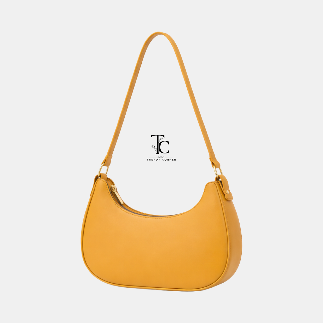 Trendyspot.pk women's shoulder bag in moon mustard color, stylish accessory with adjustable strap and spacious interior.