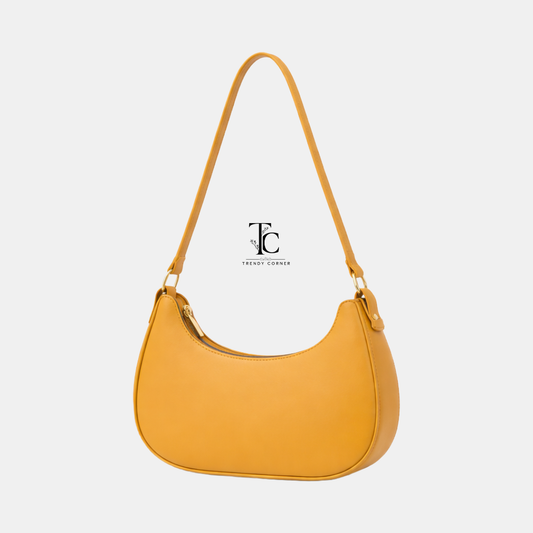 Trendyspot.pk women's shoulder bag in moon mustard color, stylish accessory with adjustable strap and spacious interior.