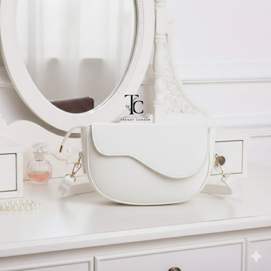 White curved flap women's shoulder bag with adjustable strap, stylish design, and trendy look from Trendyspot.pk.