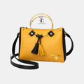 Round yellow and black women's shoulder bag with stylish design, featuring a trendy look and comfortable shoulder strap.