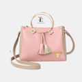 Pink and skin-toned women's shoulder bag with a round shape, stylish design, from Trendyspot.pk.