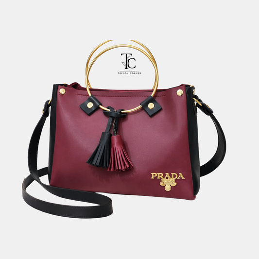 Round Meroon and Black women's shoulder bag with stylish design, featuring a sleek leather finish and adjustable strap.