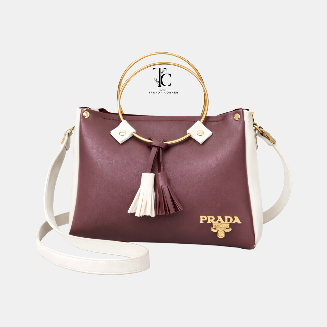 Maroon and white women's shoulder bag with round shape and stylish design, from Trendyspot.pk.