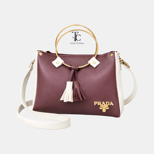 Maroon and white women's shoulder bag with round shape and stylish design, from Trendyspot.pk.