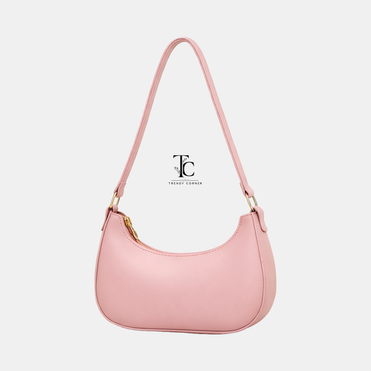 Pink women's shoulder bag from Trendyspot.pk, featuring stylish design and comfortable strap for everyday use.